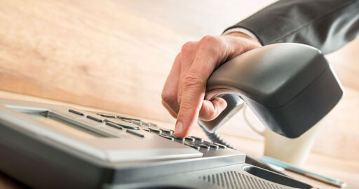 The hand of a person using a phone